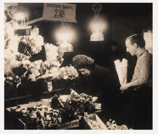 David Shaw Snr at the flower stand in the 1960s, with Buxton daffodils priced at 2/6 a bunch